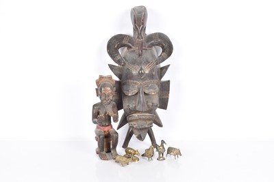 Lot 408 - An African carved figure of a seated female