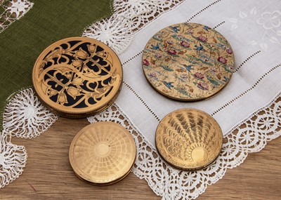Lot 583 - Four gilt metal 1950s circular Zenette and Zenette style compacts