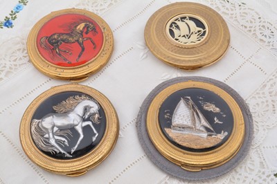 Lot 602 - Four circular gilt metal Kigu compacts