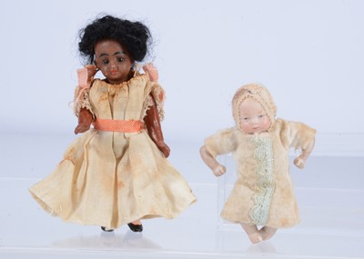 Lot 424 - A German bisque headed brown dolls' house doll