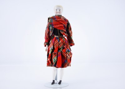 Lot 453 - A mid 19th century bisque shoulder-head boy doll
