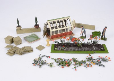 Lot 843 - A small selection of Britains garden items with a Hill Greenhouse