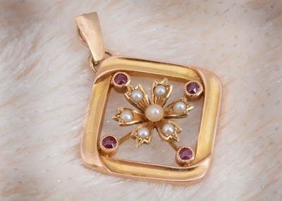 Lot 11 - A 15ct gold ruby and seed pearl drop pendant