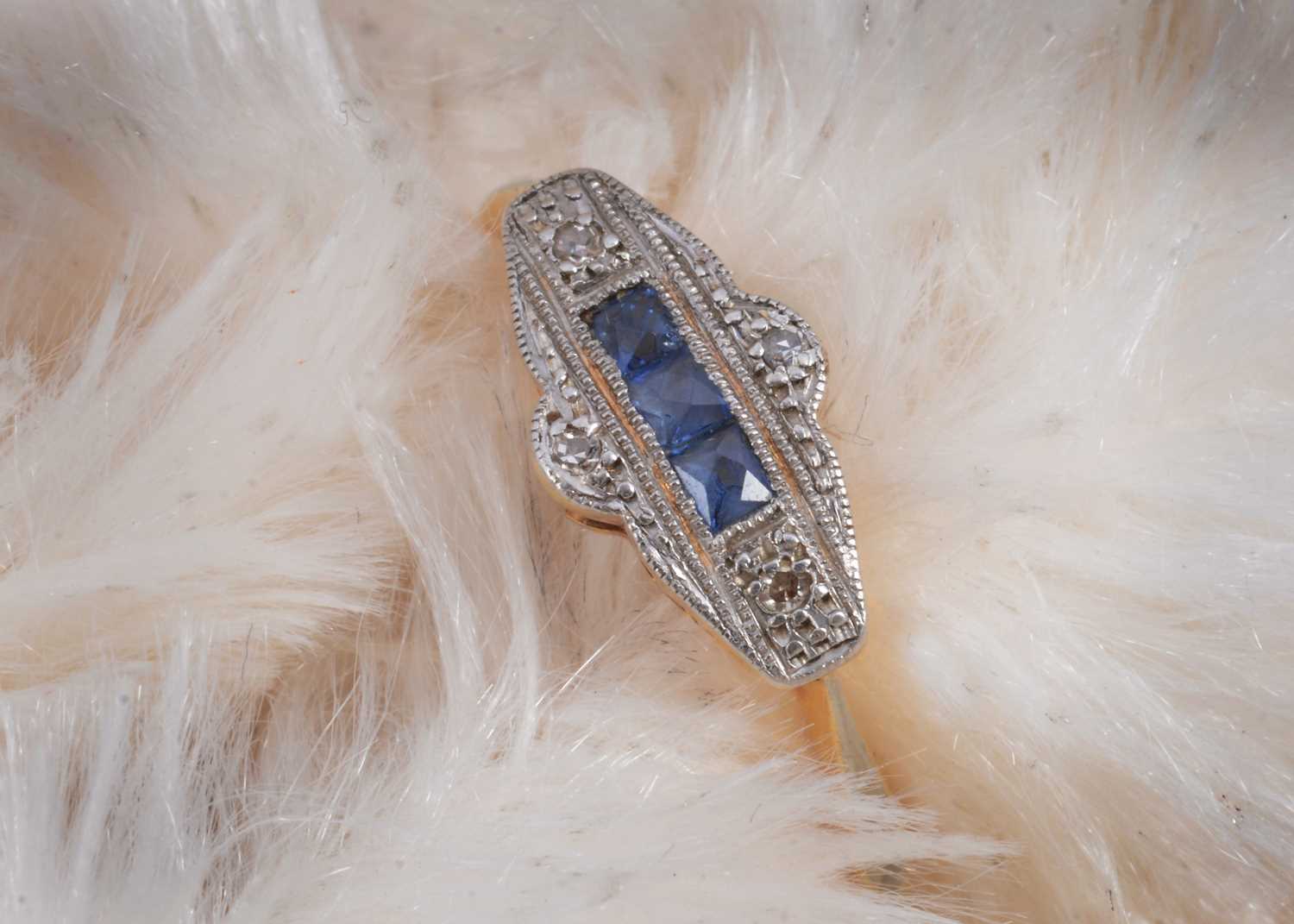 Lot 23 - An 18ct gold and platinum set art deco sapphire and diamond dress ring