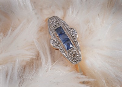 Lot 23 - An 18ct gold and platinum set art deco sapphire and diamond dress ring