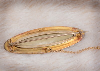 Lot 30 - A 15ct gold seed pearl and demantoid garnet oval brooch with box back