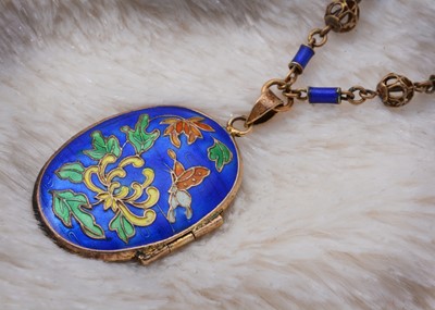 Lot 43 - A Chinese silver gilt and enamel oval locket