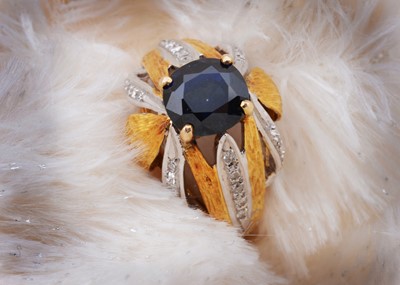 Lot 55 - A continental sapphire and diamond two colour 18k marked dress ring
