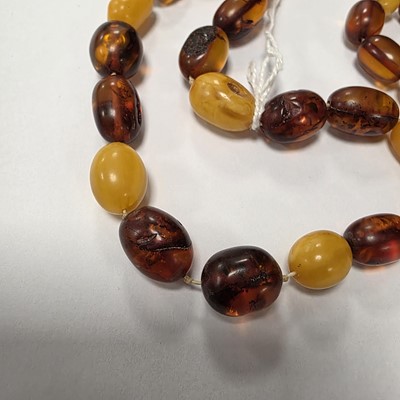 Lot 78 - A string of oval amber beads