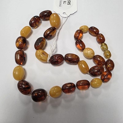 Lot 78 - A string of oval amber beads