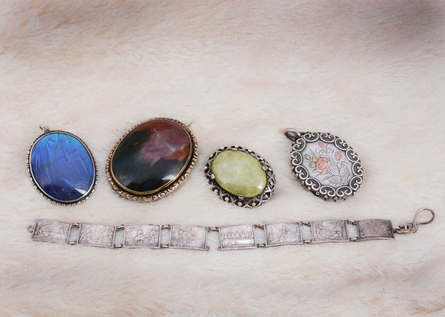 Lot 82 - A large ruby in zoisite silver set oval brooch