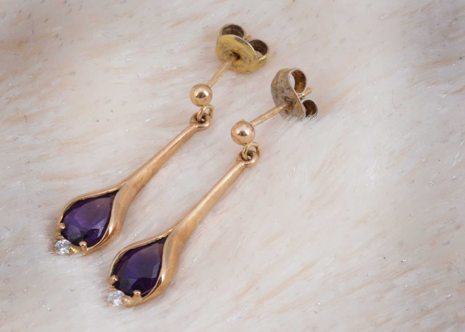 Lot 93 - A pair of 9ct gold amethyst and cubic zirconia pendant drop earrings