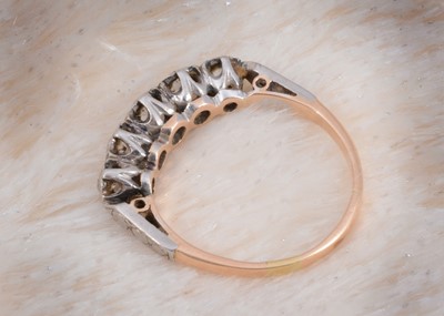 Lot 95 - A five stone diamond 18ct gold and platinum set dress ring