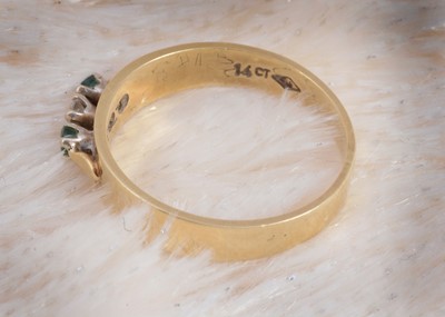Lot 96 - A continental 14k marked diamond and emerald dress ring