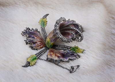Lot 135 - A large white metal enamel and marcasite orchid brooch