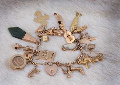 Lot 136 - A 9ct gold fancy link charm mounted bracelet