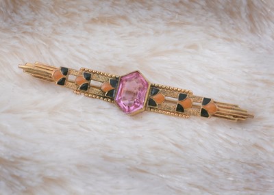 Lot 186 - A yellow metal enamel and pink gem set bar brooch