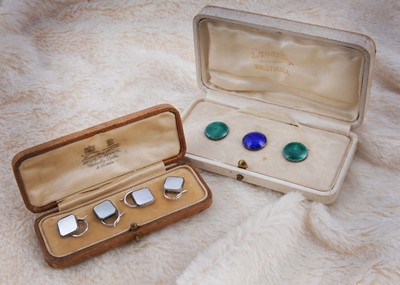 Lot 214 - A set of three white metal and enamel buttons