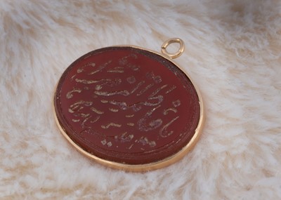 Lot 230 - A Middle Eastern carnelian oval jewel