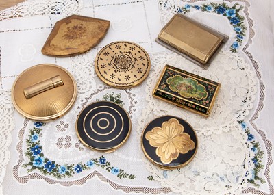 Lot 331 - Seven gilt metal Melissa compacts