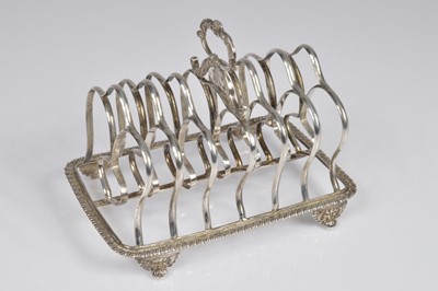 Lot 359 - A George IV silver toast rack by RP