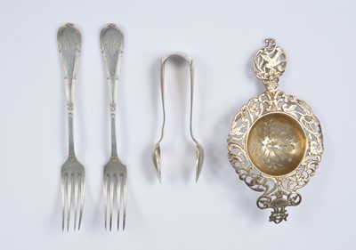 Lot 390 - A late Victorian silver tea strainer