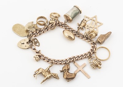 Lot 2 - A 9ct gold and yellow metal charm bracelet