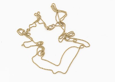 Lot 23 - An early 20th century yellow metal muff chain