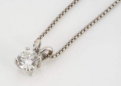 Lot 80 - A diamond solitaire drop pendant