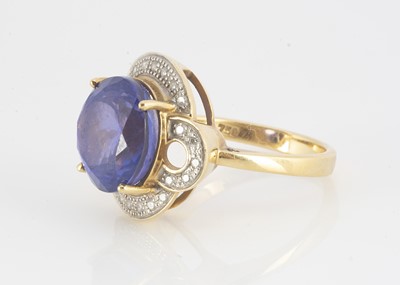 Lot 104 - An 18ct gold diamond and tanzanite dress ring