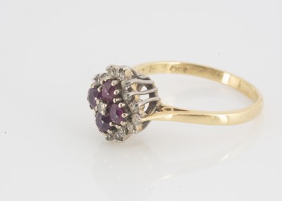 Lot 112 - A ruby and diamond cluster cruciform dress ring