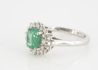 Lot 123 - An Iliana 18ct white gold emerald and diamond dress ring