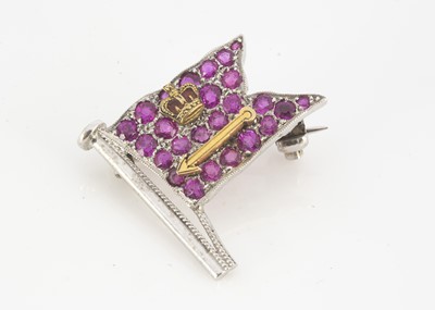 Lot 125 - A 9ct gold ruby and diamond regimental flag brooch