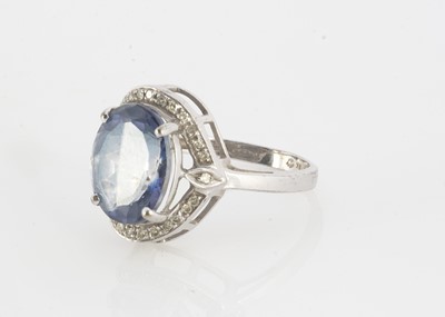 Lot 127 - A 9ct gold blue topaz and diamond dress ring