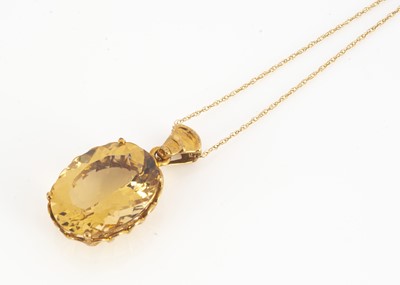 Lot 128 - A contemporary citrine oval drop pendant