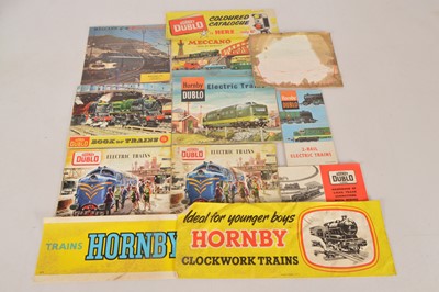 Lot 200 - Original Hornby-Dublo 00 Gauge 2-Rail and 0 Gauge Shop Paper stickers and Dublo colour Train shop window Transfer and various Dublo Catalogues (12)