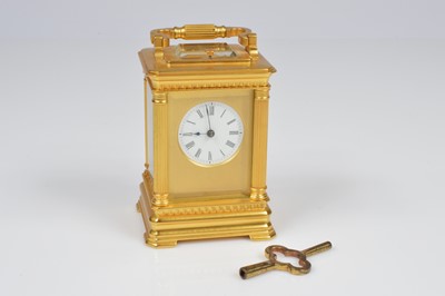 Lot 3 - A sweet small brass carriage repeater clock