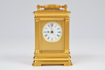 Lot 3 - A sweet small brass carriage repeater clock