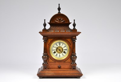 Lot 4 - A late Victorian wooden mantle clock