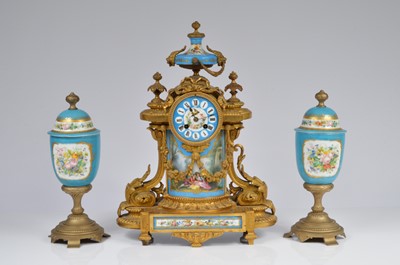 Lot 6 - A late 19th century French mantle clock and associated garniture