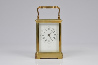 Lot 11 - A brass carriage timepiece from Howell James & Co