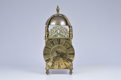 Lot 12 - An antique brass lantern clock