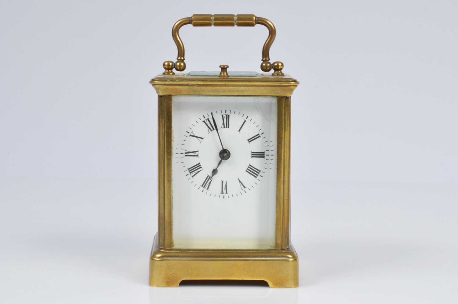 Lot 15 - A small early 20th century brass carriage repeater timepiece