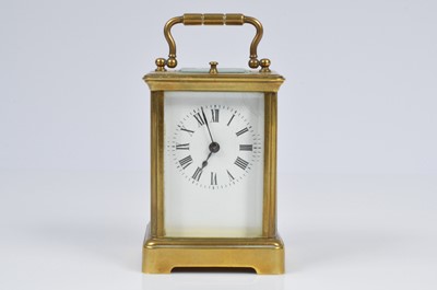 Lot 15 - A small early 20th century brass carriage repeater timepiece