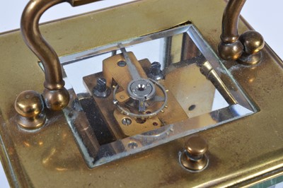 Lot 15 - A small early 20th century brass carriage repeater timepiece