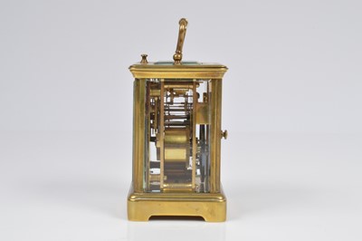 Lot 15 - A small early 20th century brass carriage repeater timepiece
