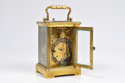 Lot 15 - A small early 20th century brass carriage repeater timepiece
