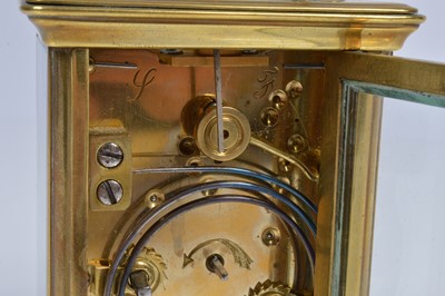 Lot 15 - A small early 20th century brass carriage repeater timepiece