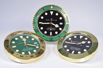 Lot 32 - A set of three modern Watch Dealership style wall clocks