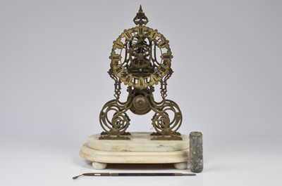 Lot 35 - An early 20th century skeleton clock